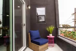 Spacious Studio – Balcony, Desk, A/C & Kitchen - Image 3